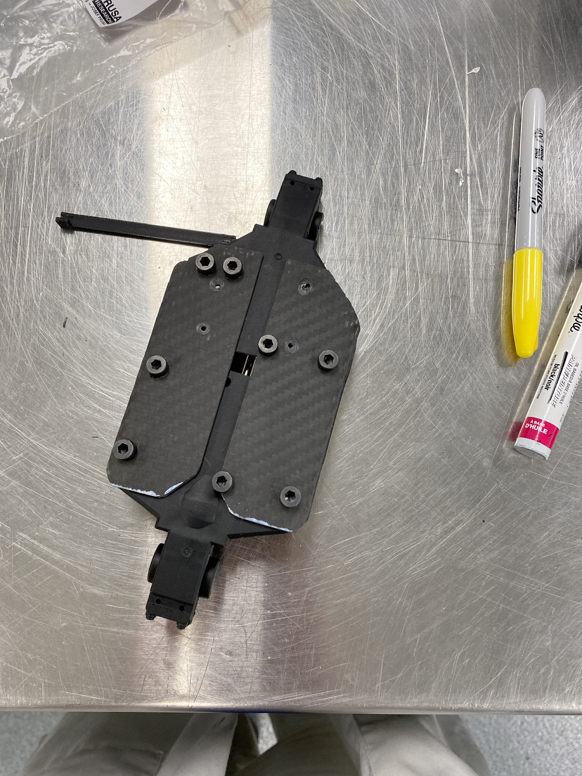 Wet-layup composite attached to chassis